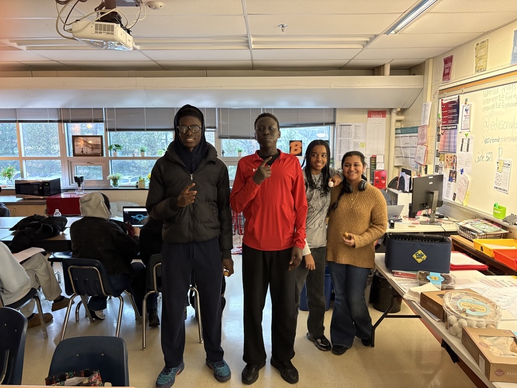 students standing in a classroom