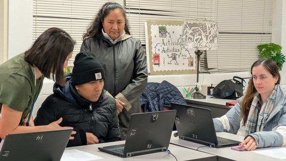 Staff helping family