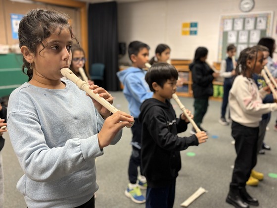 students playing recorders 