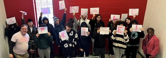 students posing with pink