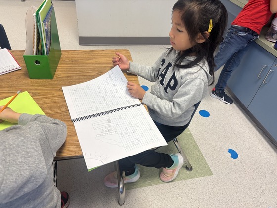 First grade student during writing 