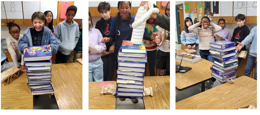 Groups of students stacking heavy textbooks on top of their popsicle-stick bridge between two tables.