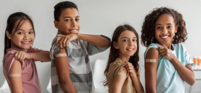 picture of three girls and one boy with bandaids on their arm for immunizations