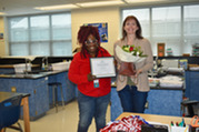 Outstanding Teacher Dr. Danielle Ross with her award