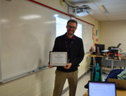 Outstanding New teacher Ryan Gesme with award