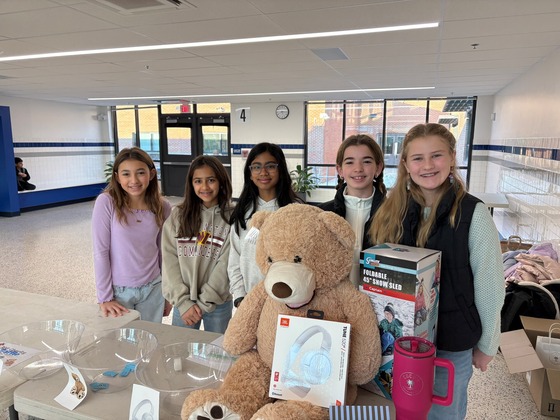 students at fundraising table