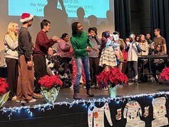 high school students performing together on stage
