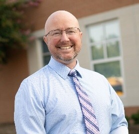 Man standing smiling