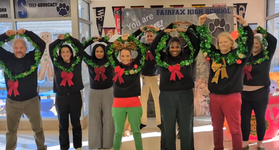 Staff wearing holiday outfits