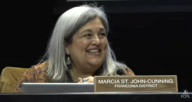 School Board Member Marcia St. John-Cunning seating behind dais 