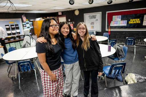 Students smile for a photo before their theatre class