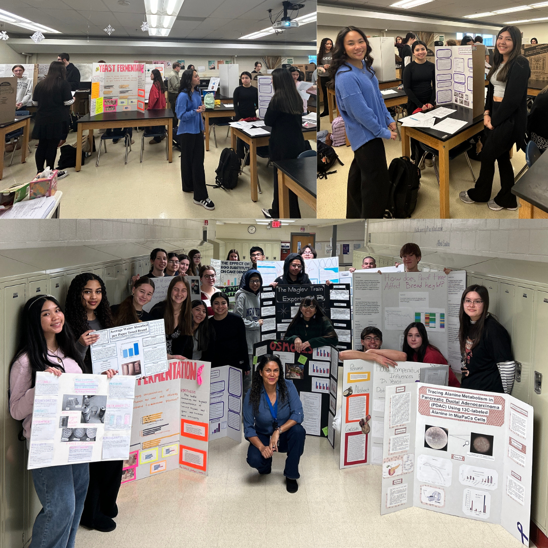 students standing in front of their science fair boards