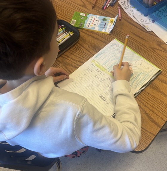 A student writes in his writing journal
