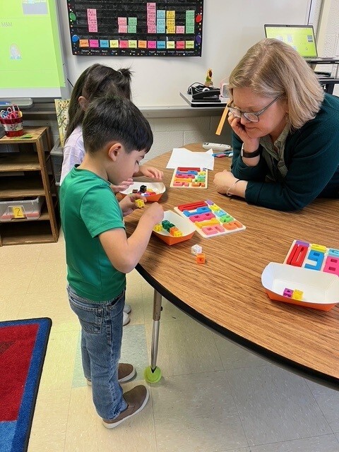 Ms. M&M and students