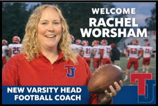 Woman standing holding football
