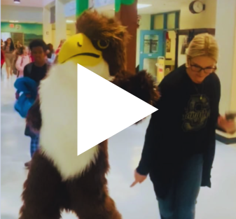 Principal and Falcon celebrating Snow Days