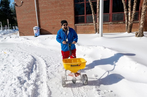 Facilities staff removing snow