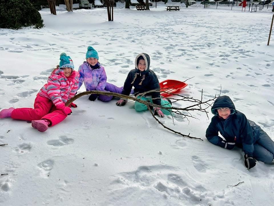 Students smile in the snow 