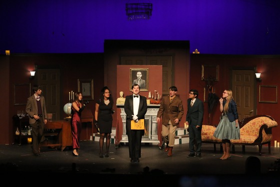 students performing theatre on stage