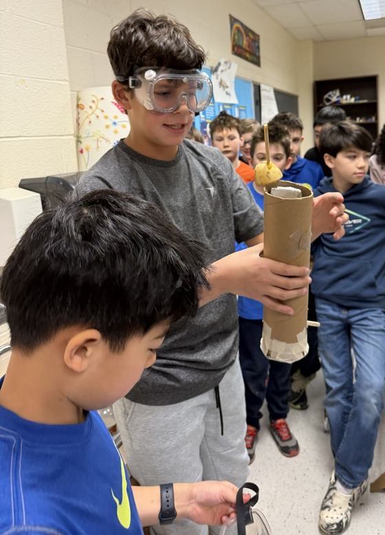 5th graders in STEAM working to build devices to help people survive during natural disasters