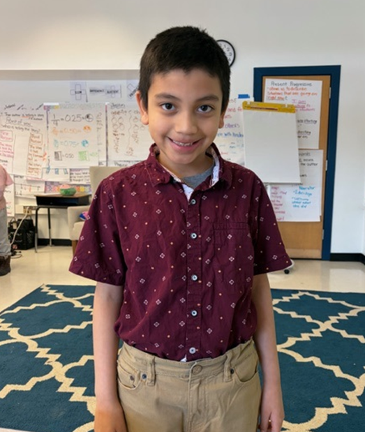 Student dressed in a button up shirt and trousers