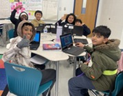 Picture of fifth-grade students using Lexia on their computers. 