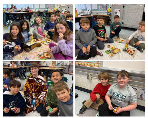 Students eating lunch on a picnic blanket
