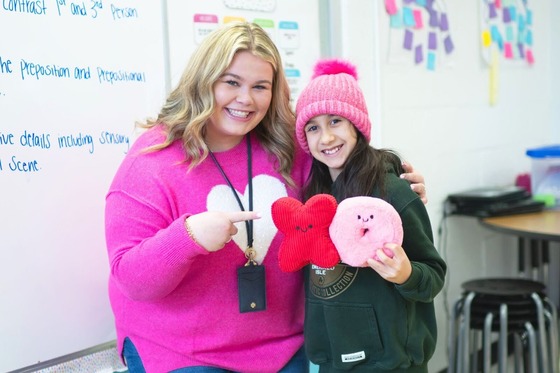 teachers smiling with student