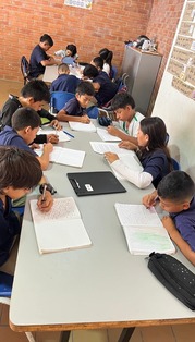 Partner Class sitting at a table