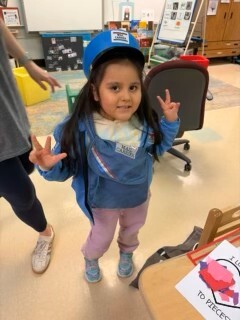 Preschooler dressed as a mail person
