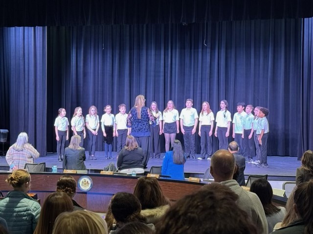singing at the school board meeting