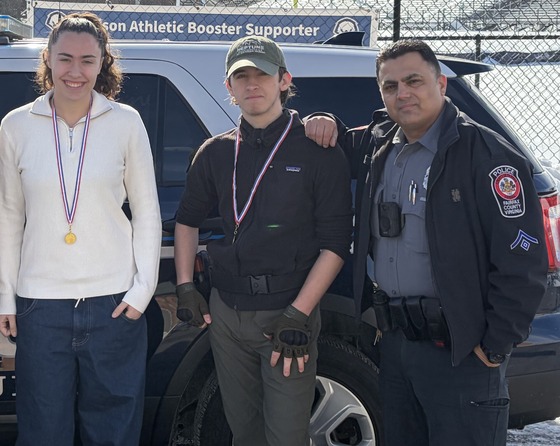 students with their medals and the school resource officer