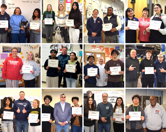 student winners with their certificates and teacher