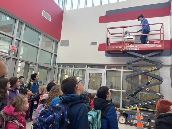 Image of students and mural