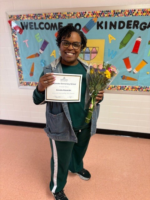 Ms. Alexander with her award