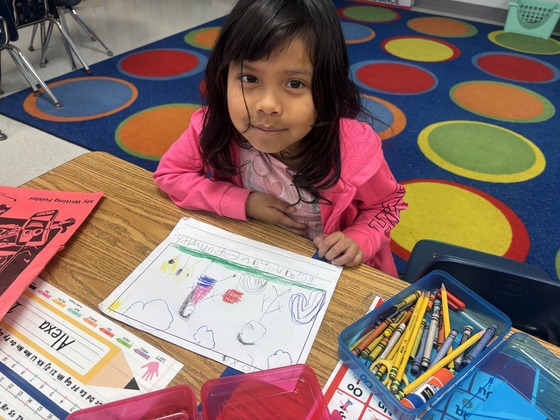 Student smiling with her writing 