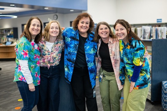 Mosaic Elementary School Staff smiling in their tropical shirts for a spirit day