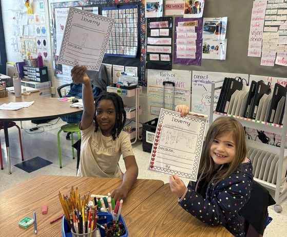 Students writing Valentine's Day notes about things they love