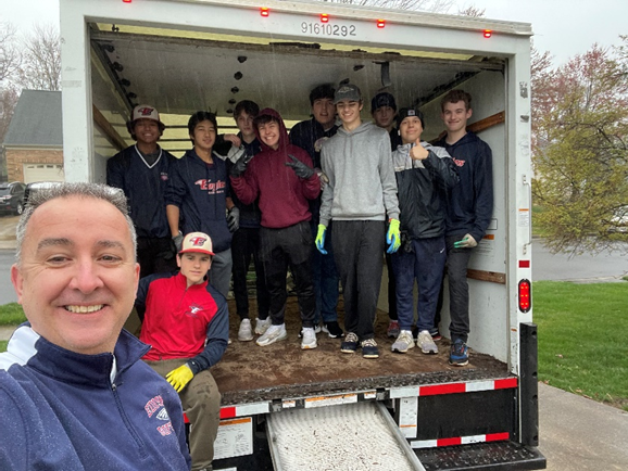 students standing in a box truck