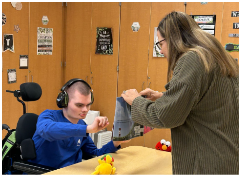 Key Center Celebrated Read Across America Day - Emily reading to student