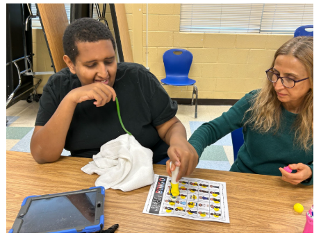 Celebrating Black History with Bingo Fun!- student and staff playing bingo