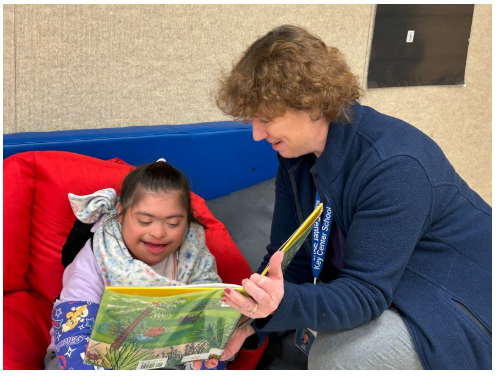 Key Center Celebrated Read Across America Day - Ann Smith reading to student