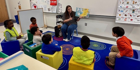 Music teacher working with students