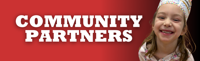 Girl smiling on red and black gradient background with 'COMMUNITY PARTNERS' in white writing