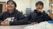 Two sixth grade news anchors