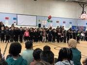 Kinder students singing.