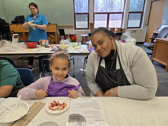 Mentee and Mentor Making apple donuts