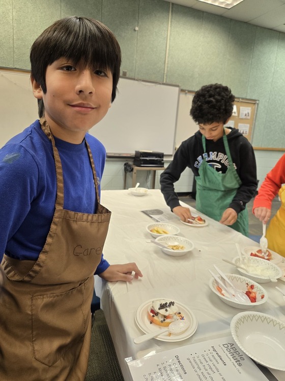mentees "cooking" apple donuts
