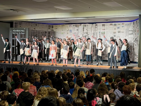 Students performing in Newsies Jr.