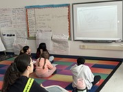 Fifth grade students participating in a science lesson. 